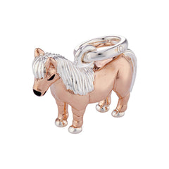 A sterling silver charm shaped like a Shetland pony with a coating of warm rose gold vermeil, featuring a loop for a bracelet or necklace attachment.