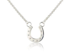 A sterling silver horseshoe necklace with sparkly cubic zirconia stones on a silver chain, displayed against a white background.