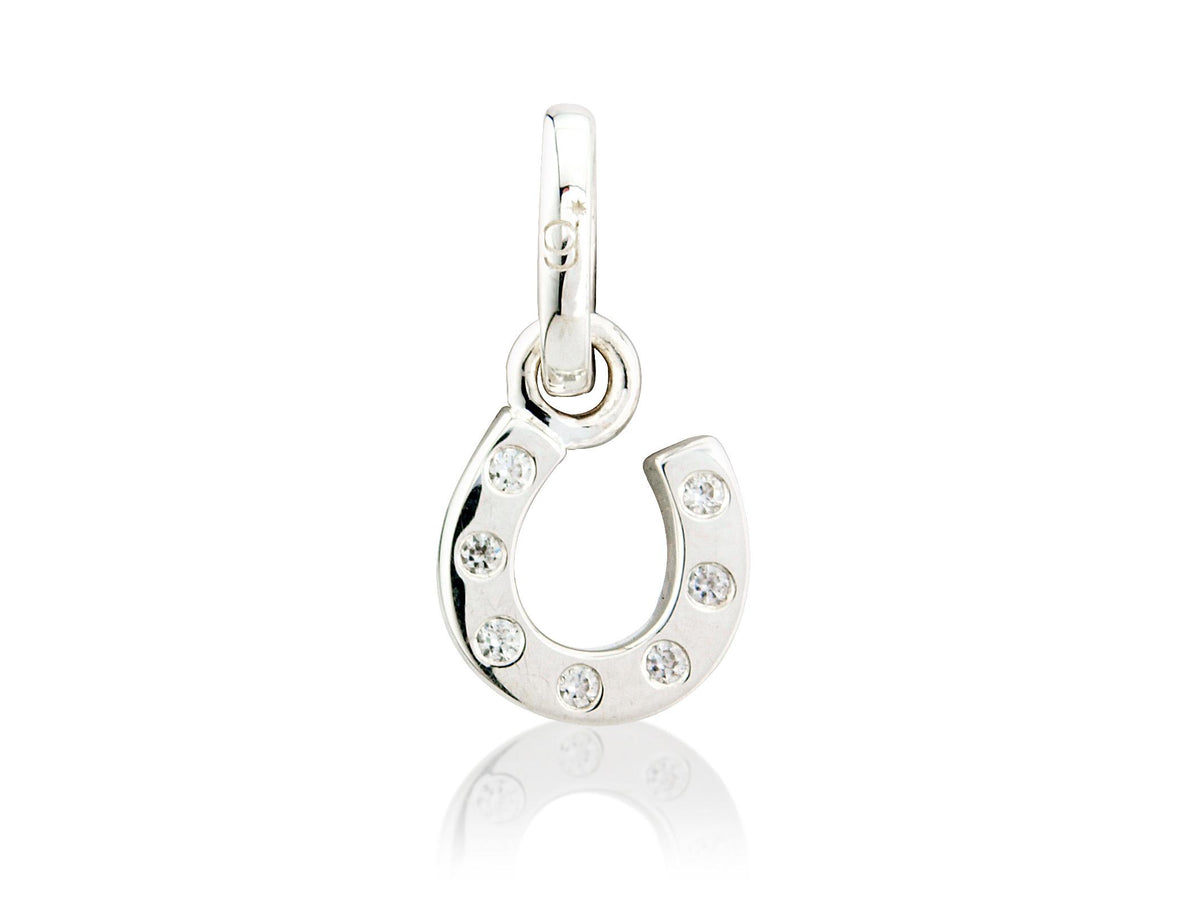 A sterling silver horseshoe charm with cubic zirconia stones embedded within it.