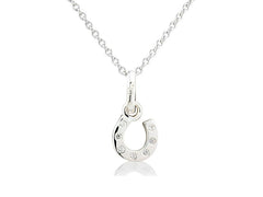 A sterling silver horseshoe pendant decorated with sparkly stones on a chain.