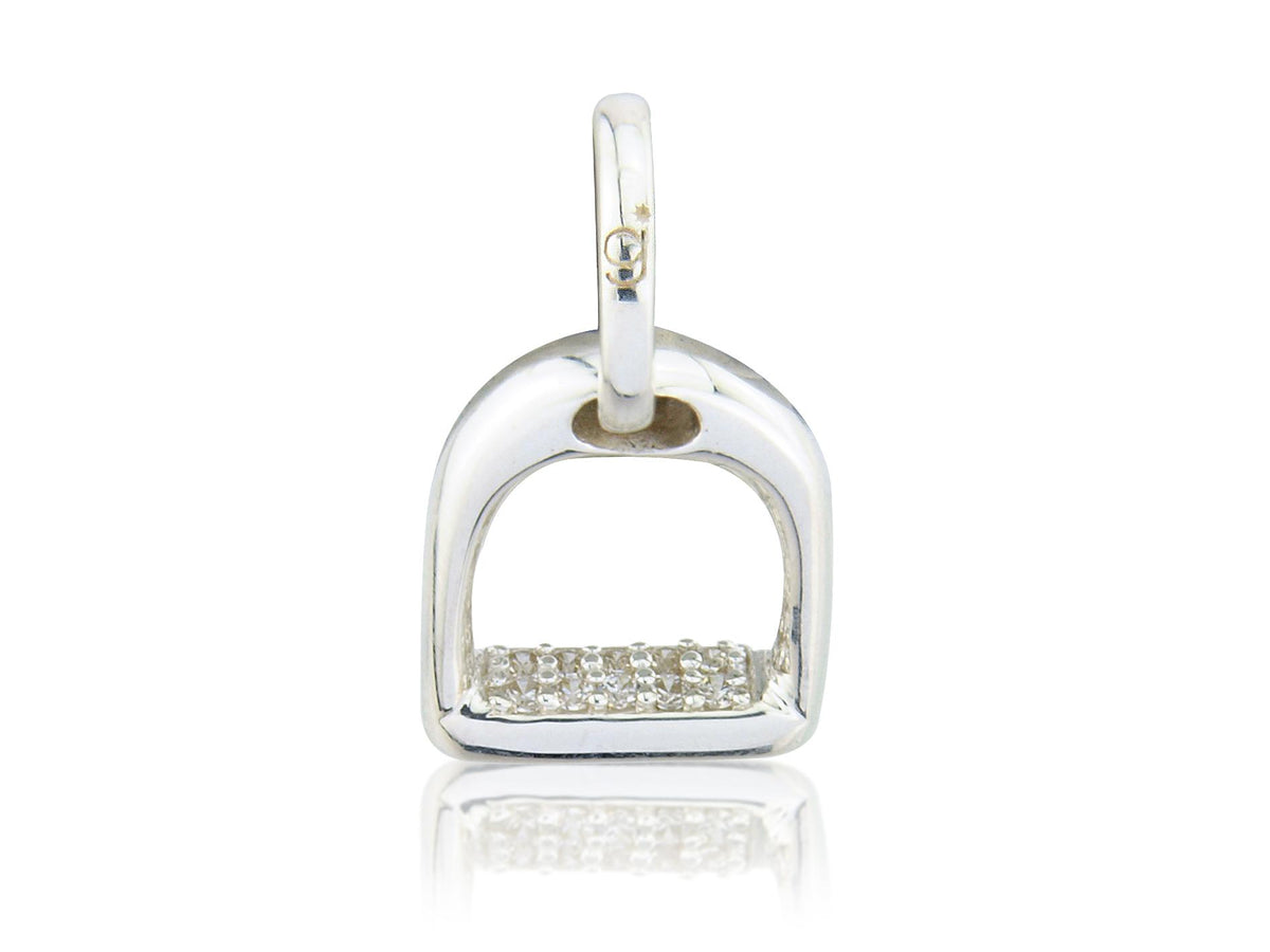 A sterling silver charm with a stirrup design, decorated with sparkly stones, on a white background.