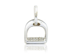 A sterling silver charm with a stirrup design, decorated with sparkly stones, on a white background.