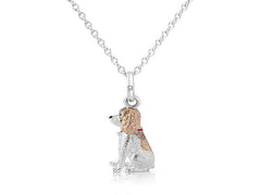 A sterling silver pendant in the shape of a Springer Spaniel dog with rose gold highlights, attached to a silver chain.