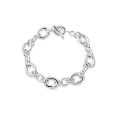 A sterling silver T bar charm bracelet with a toggle fastening.