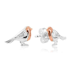A pair of silver and rose gold stud earrings in the shape of robins.