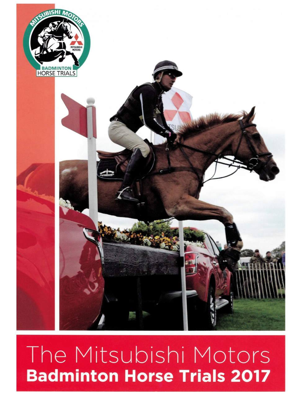 Cover of the 'The Mitsubishi Motors Badminton Horse Trials 2017 Highlights' DVD featuring a horse and rider in mid-jump over a fence, with spectators and a red car in the background.