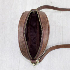 brown leather bag from above with zips open 