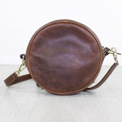 brown leather bag from back view with straps