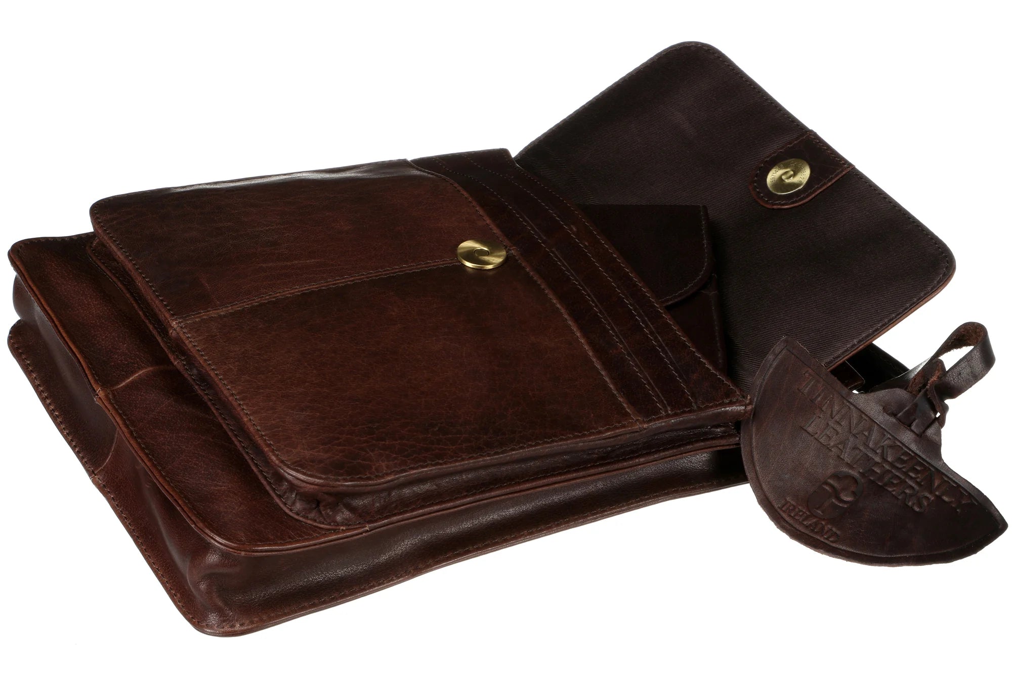 Sling shoulder bag in tan leather open showing compartments 