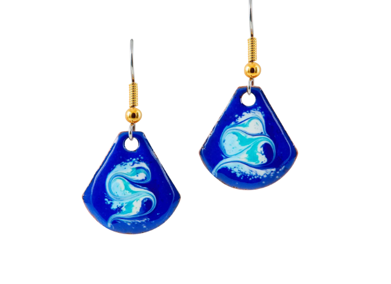 Blue earrings with white designs on a white background
