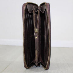 brown leather purse open showing compartments and zip